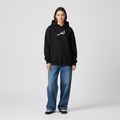 Black hoodie with white Arabic text on a white background